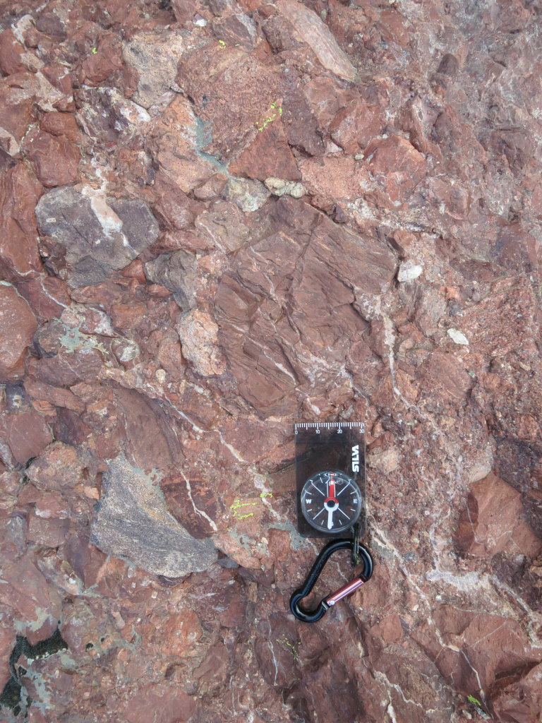 Conglomerate! As a True Geologist, I have to show an image of rocks with a compass on.