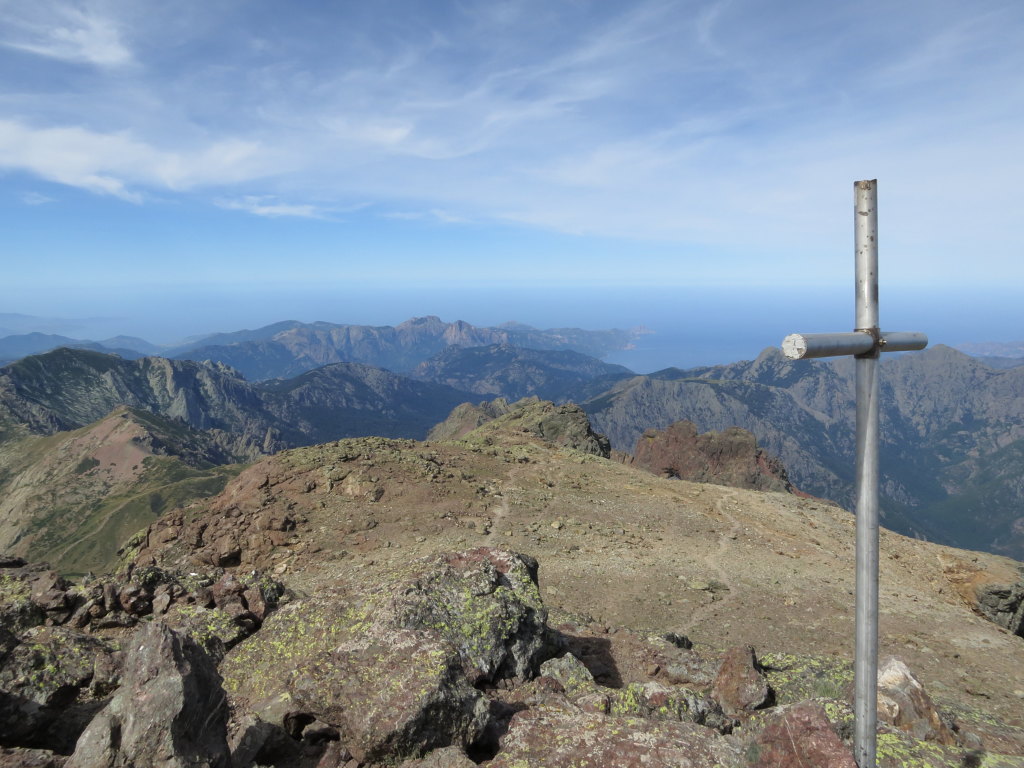 The summit of Paglia Orba, with a view all the way to the West coast. The cross commemorates climbers that have lost their lives on the mountain.