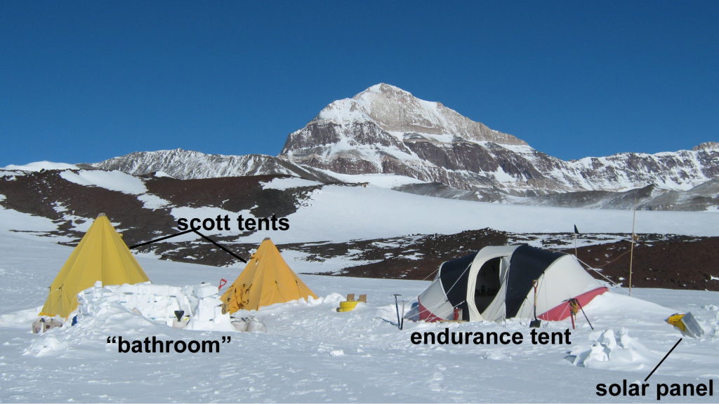 Figure 5. A typical field camp consists of several scott tents and an endurance tent. Full pee jugs surround our “bathroom” (yes, we take out all waste). We learned the hard way that an overfilled jug would spill as it froze and expanded.