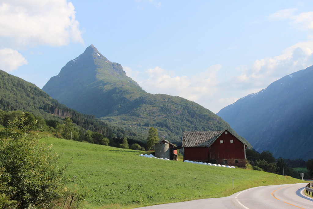 Barnhouse on the side of glacially sculpted peaks and valleys.