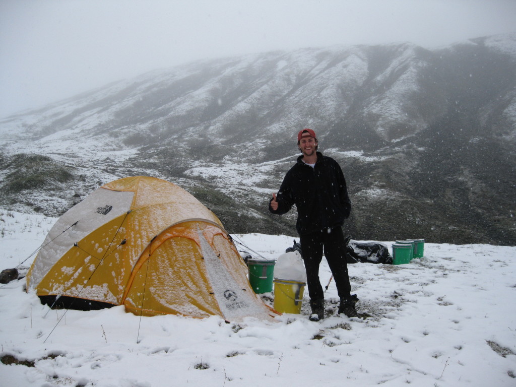 Me outside of our tent, snowed in at our second camp along the Susitna Glacier valley.