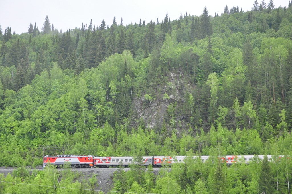 The Transsiberian Railway, passing by the Koronka reef on the other side of the Sylva river.