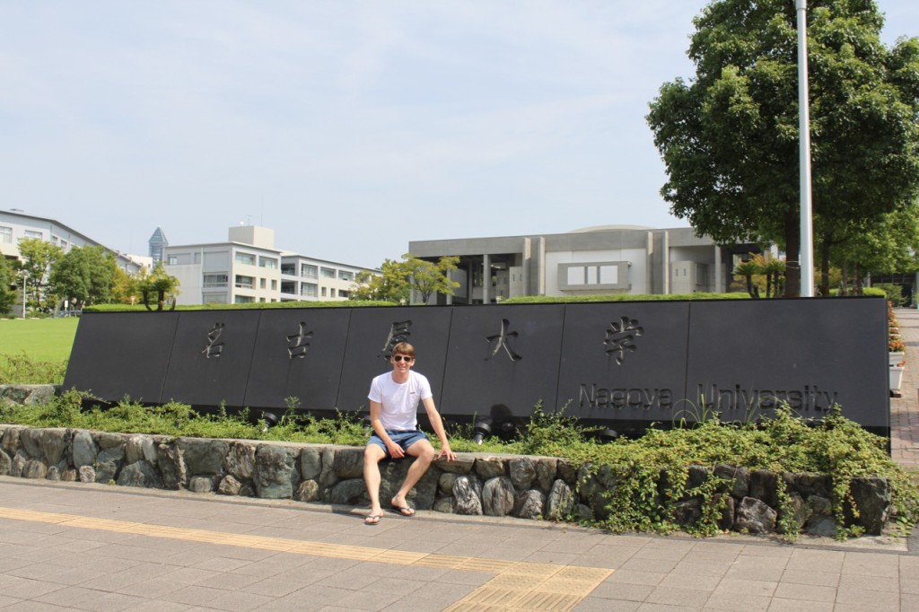Fig. 4 - Owen Weller sitting on some greenschist from the Sanbagawa belt, Nagoya campus.