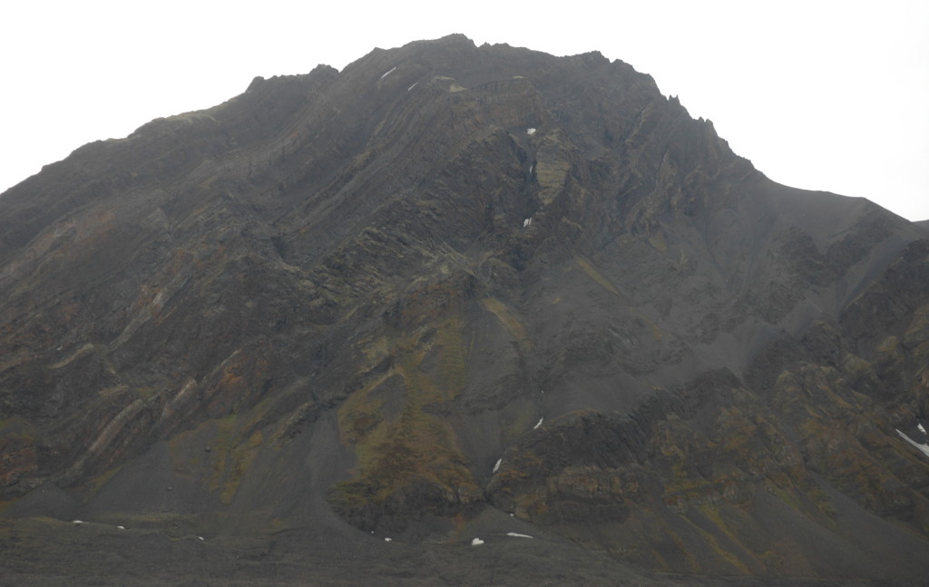 The Mediumfjellet thrust, on the North side of Isfjorden, Svalbard: Permian evaporite, Triassic shale and sand, intruded by a Cretaceous dolerite, and then thrusted up by the compression from Greenland.