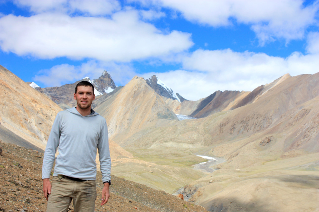 Andrew Laskowski striking a pose, with the help of field assistant Clay Campbell, high in the Lopu Range.