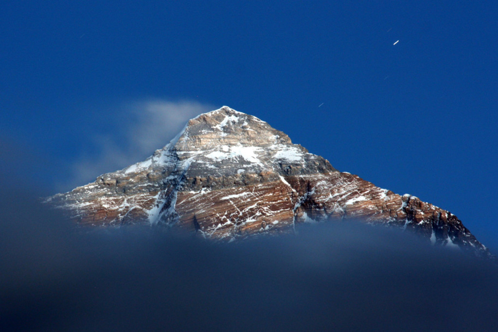 A photo of the summit of Qoomalangma (Everest) illuminated by moonlight taken by the author during field work in 2011.