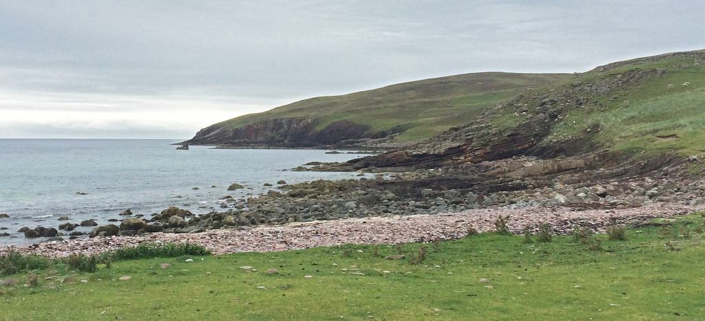 Fig. 1 – The start of the walk from near the graveyard south of Stoer. The Stac Fada Member forms the promontory of rock that extends to the sea stack just visible centre left.