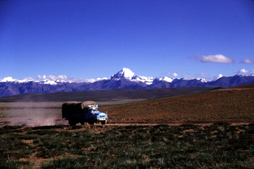 Doing geology in Tibet requires hauling all of your gear in a huge truck called a Dong Feng. That is Mount Kailas in the background. How could you not be drawn to this? (Photo by Paul Kapp).