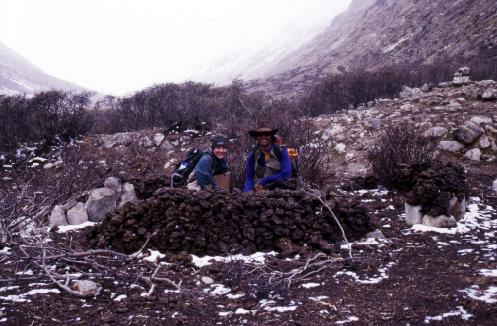 Me and Mike Taylor crouching inside a small shelter made of yak dung in the Goring La valley, Nyainqentanglha range, Tibet.