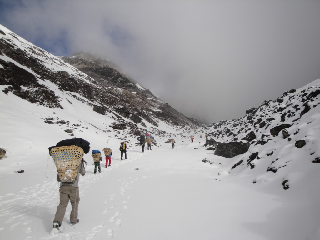 Photo 4. The crew setting out from camp in the morning heading over Gyago La in the Numbur region of east-central Nepal. (Photo credit – K.Larson)