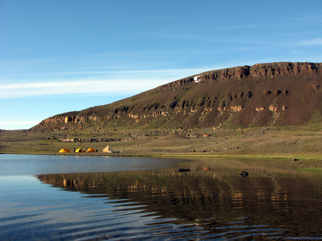 One of our camps at the base of the Natkusiak Formation. The cream-coloured unit near the base is Kuujjua Formation sandstone.