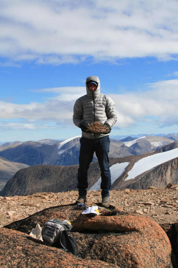 Dr. Nicolás Young with his latest catch; weathered bedrock from a small ice cap on eastern Cumberland Peninsula. 