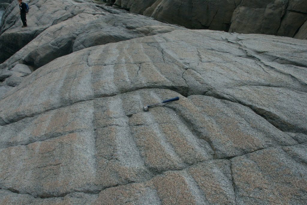 Figure 10: Modal layering in the lower zone, Slambang Bay. Modal layering is due to change in minerals percentage, in this picture, the clearer layers are plagioclase-rich and the darker ones are olivine-rich. Photo credit: Dominique Weis.