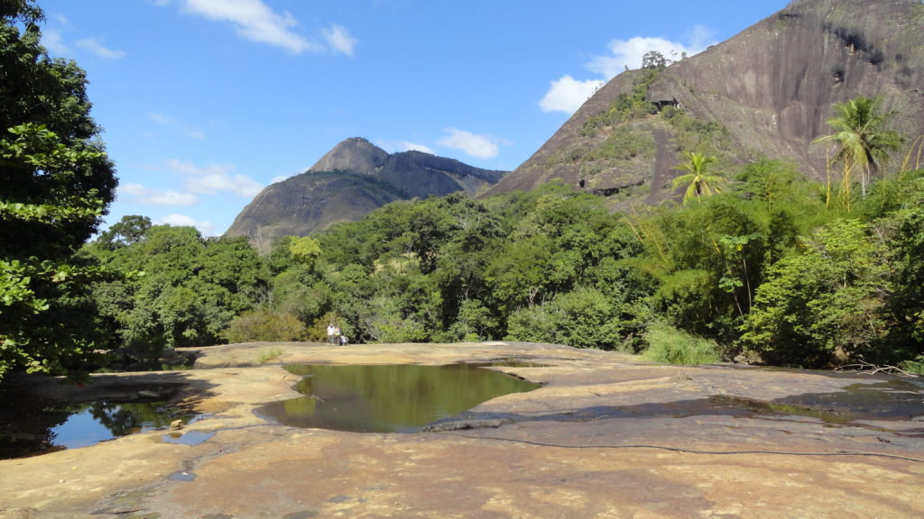 Figure 3 – Locality near the city of Nova Venecia. On the far side of the picture, Prof. Pedrosa-Soares, Dr. Kathryn Cutts and PhD candidate Marilane Gonzaga observe the features of the granitoid they are stepping on.