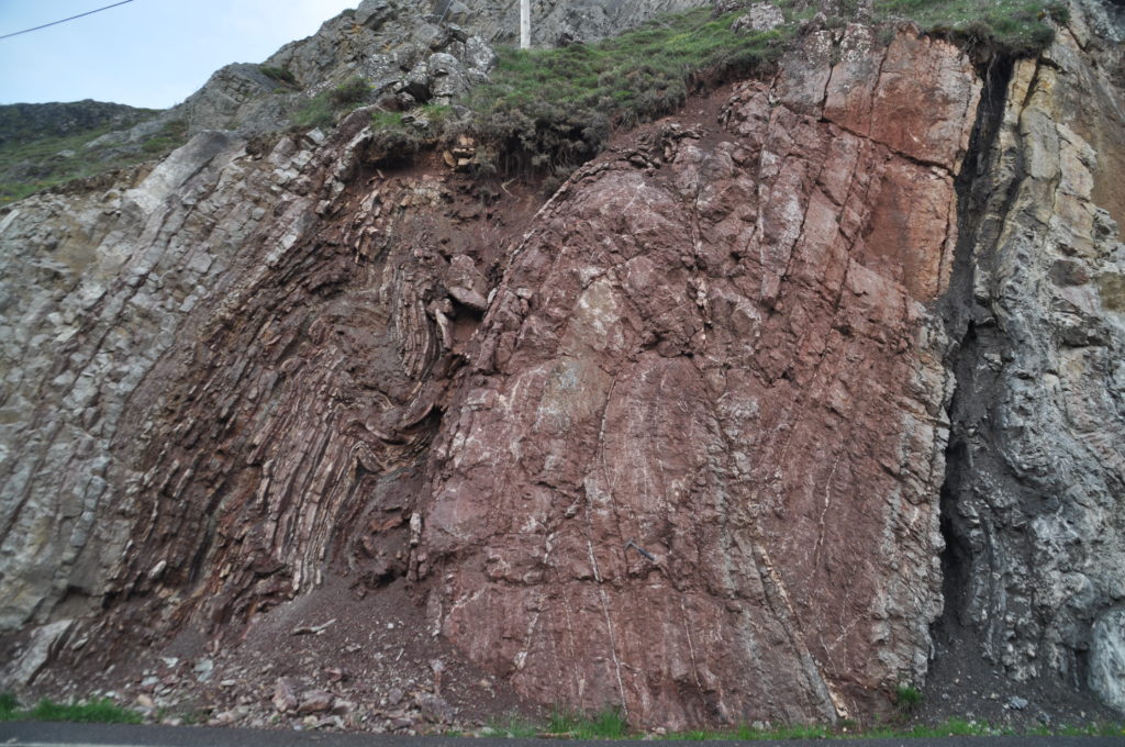 Carboniferous limestone fault propagation fold. Thrusts, folds, limestones and radiolarites dancing around. Nice party.