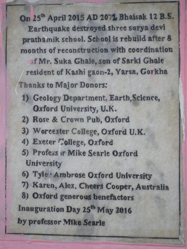 Plaque outside school entrance