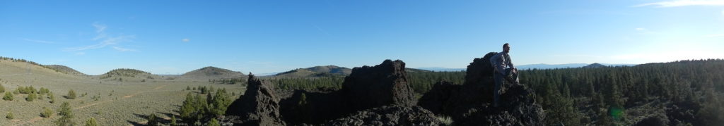 Matthew Nikitczuk standing atop an overgrown spatter cone known as The Blowouts. Photo by Nevena Novakovic.