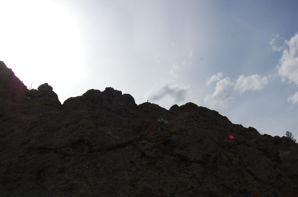 Matthew Nikitczuk (center), standing atop a Black Hills tuff deposit. Photo by Nevena Novakovic.