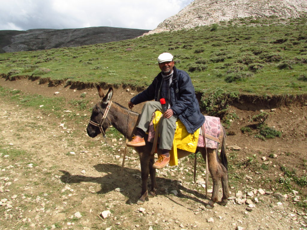 The shepherd, Akkaş, and his humble steed.