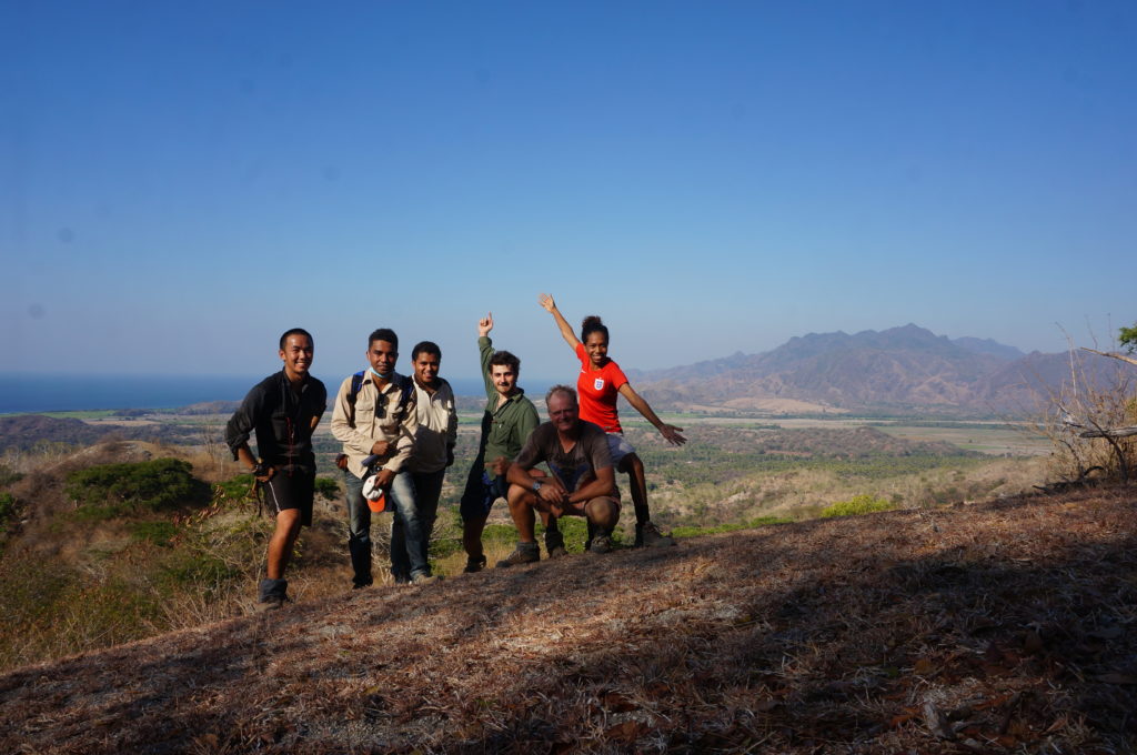 Myself, Joao Paulo, Albino, Jack, Steve and Joe conquer a thorny hill to get a nice view of the Oecusse Volcanics in the background